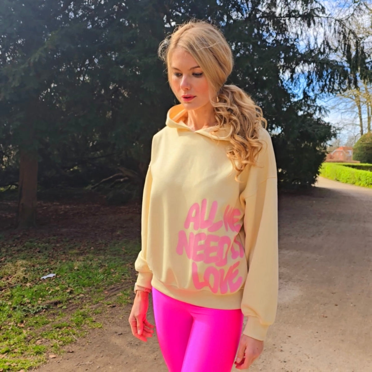 “All We Need Is Love” Oversized Hoodie – Beige with Pink Print